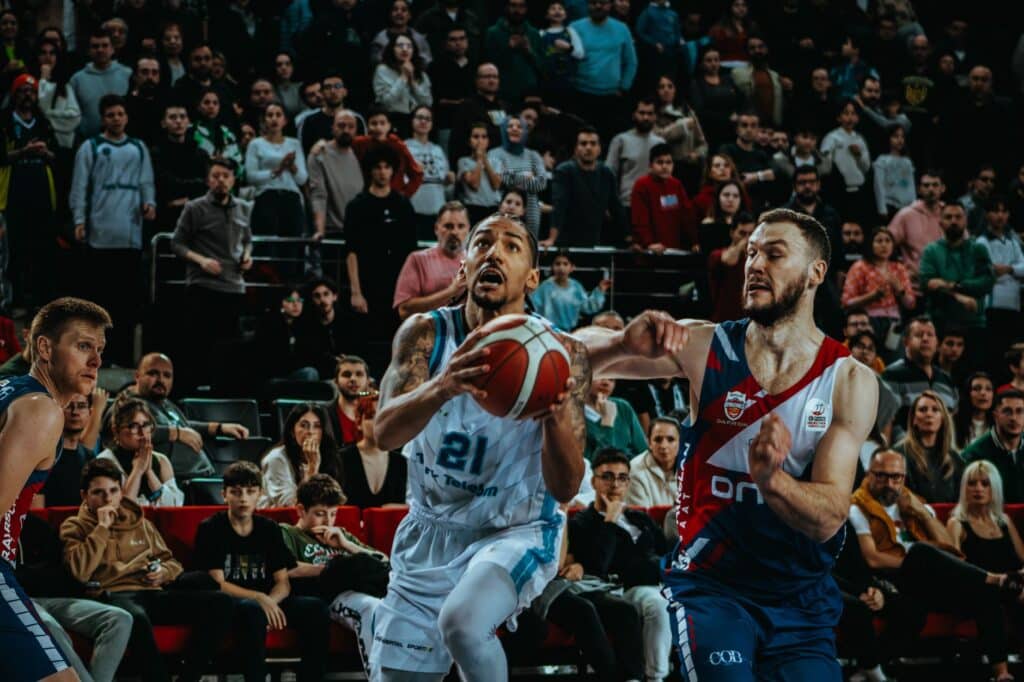 Basketball players in action on a court during a game