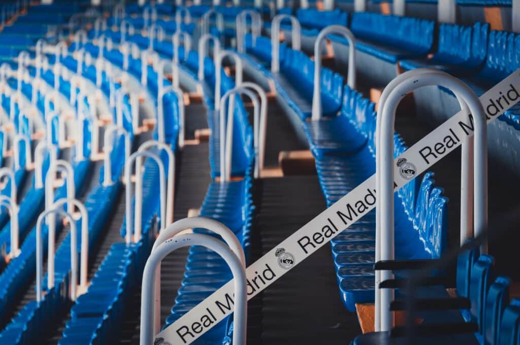Empty stadium seating overlooking a football field