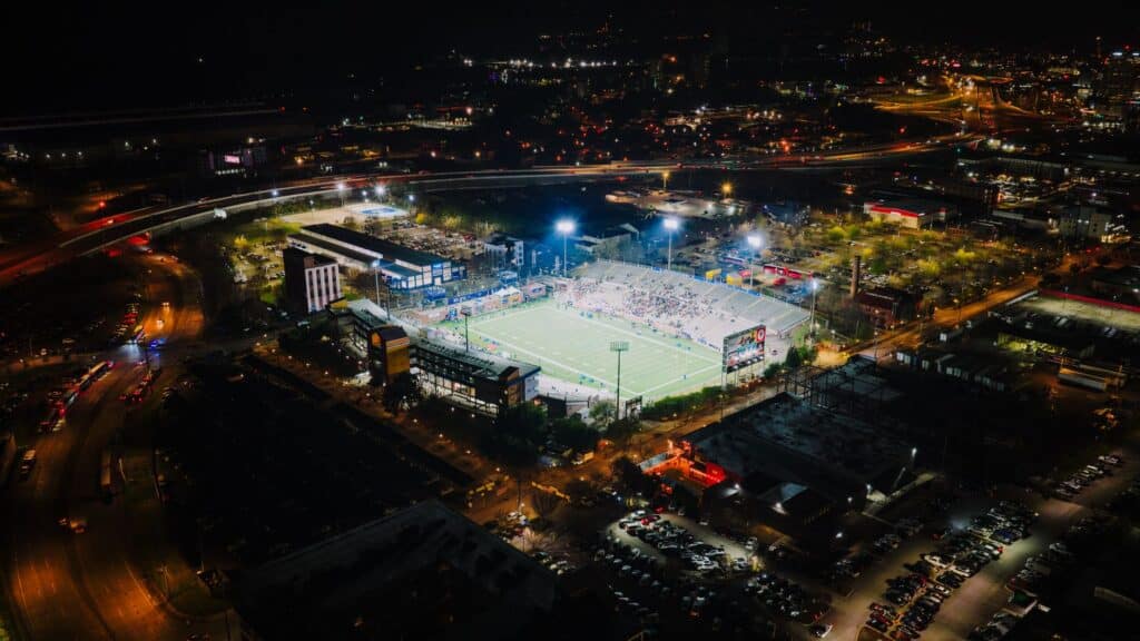 Empty American football stadium field viewed from the stands