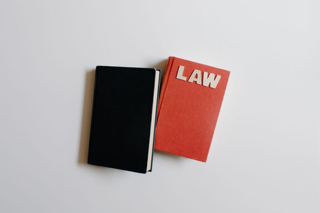 A gavel resting on top of law books symbolizing legal regulation
