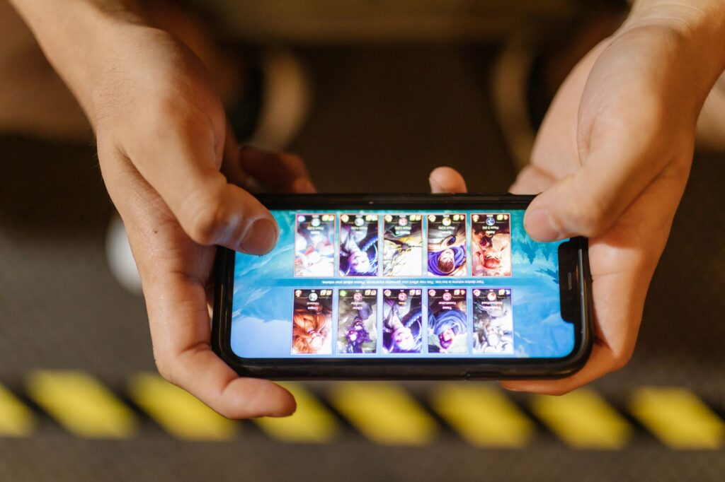 Person holding a smartphone displaying a casino gaming app