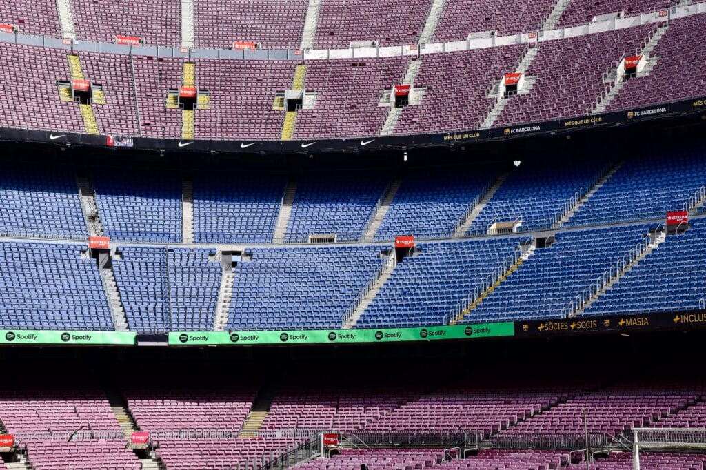 A sports betting slip alongside a stadium view, suggesting accumulator wagers