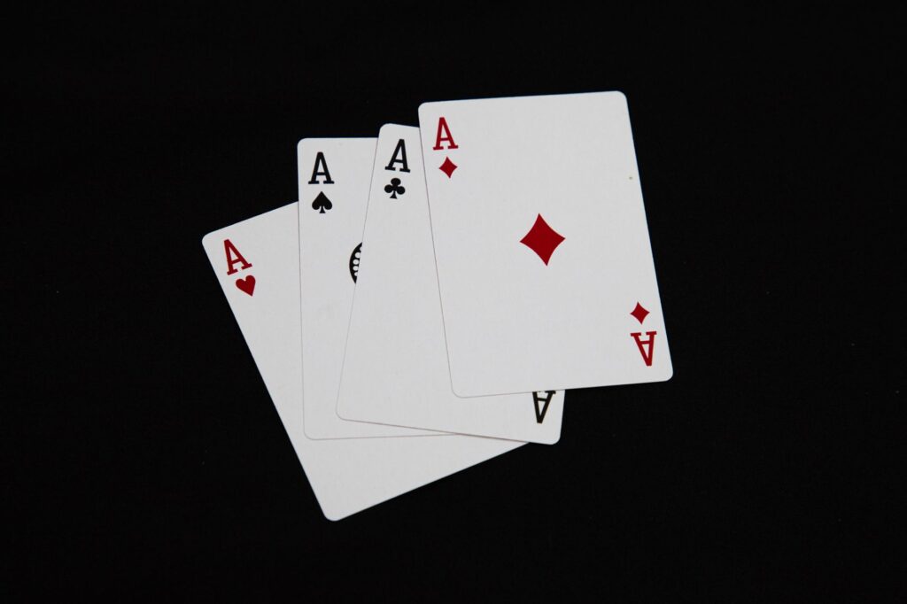 Close-up of red and black playing cards on a table