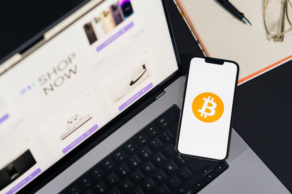 Hand holding a smartphone showing a cryptocurrency wallet transfer screen