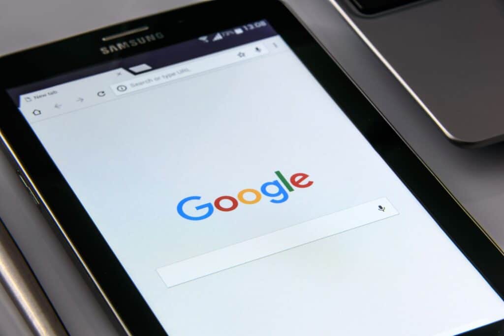 Person holding a smartphone browsing a website while walking or sitting