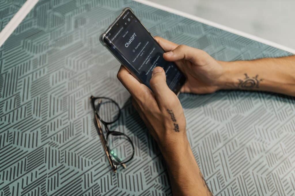 Person holding a smartphone showing a sports betting and casino app