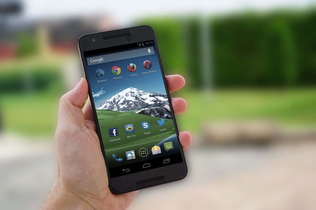 Person using a mobile browser on a smartphone outdoors