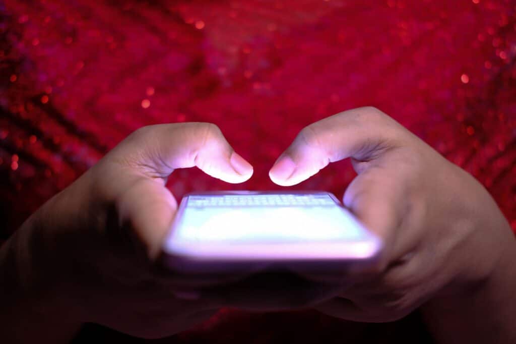 Person using a smartphone to browse a website on mobile data