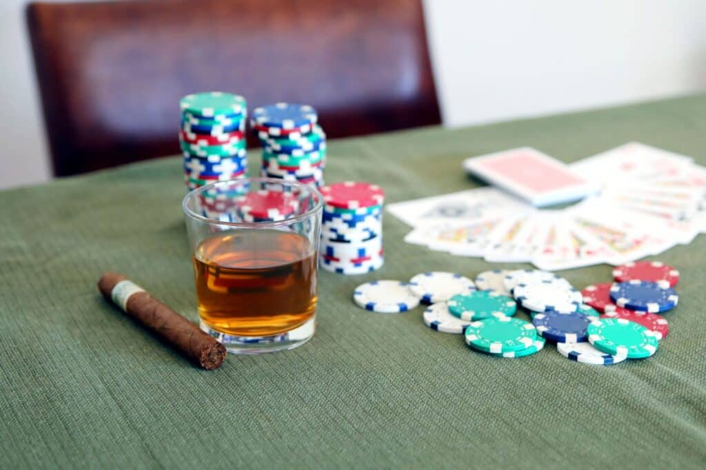 Poker chips and playing cards arranged on a table