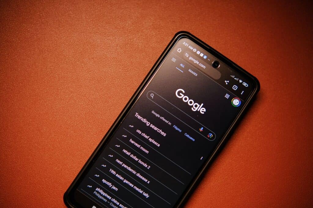 Person holding a smartphone using a mobile web browser