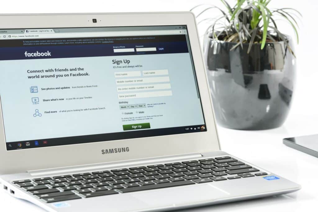 Person typing on a laptop during an online account registration process