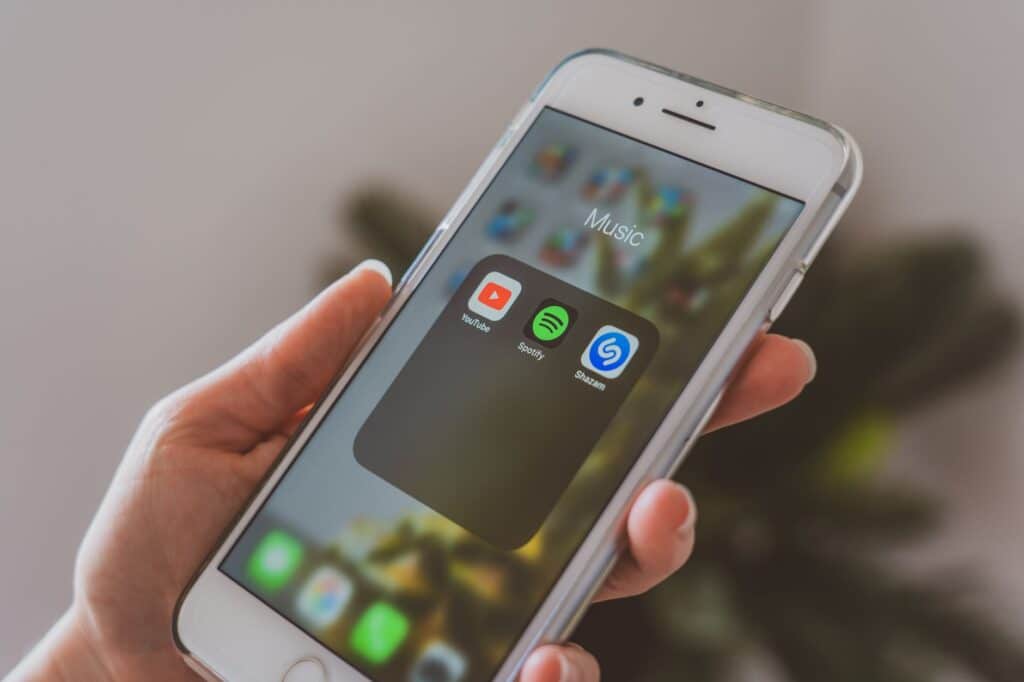 Person using a smartphone to navigate a mobile app interface